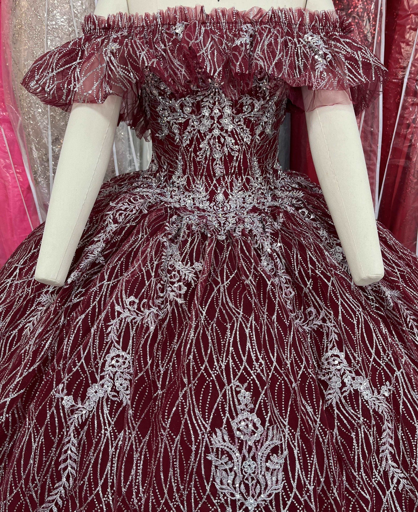 A beautiful gown, off-shoulder, reveals noble air.