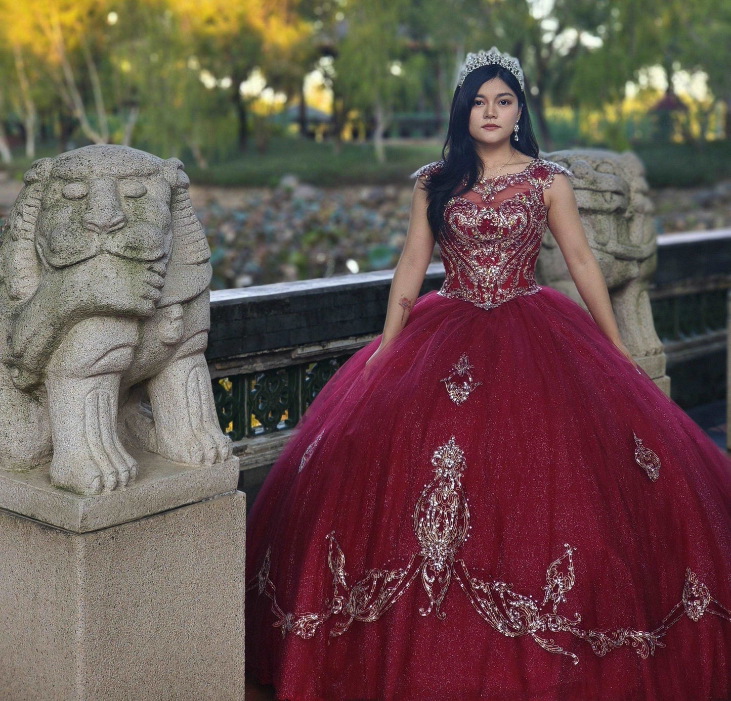 A beautiful gown, off-shoulder, reveals noble air.