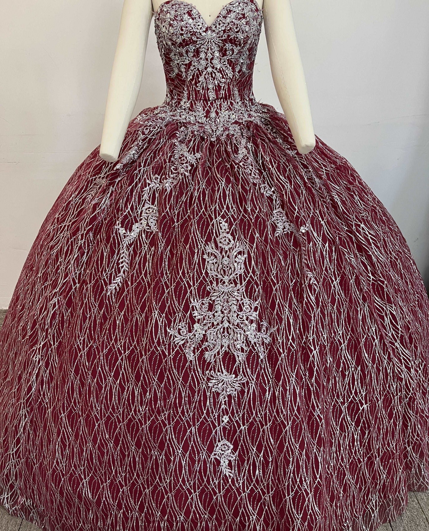 A beautiful gown, off-shoulder, reveals noble air.