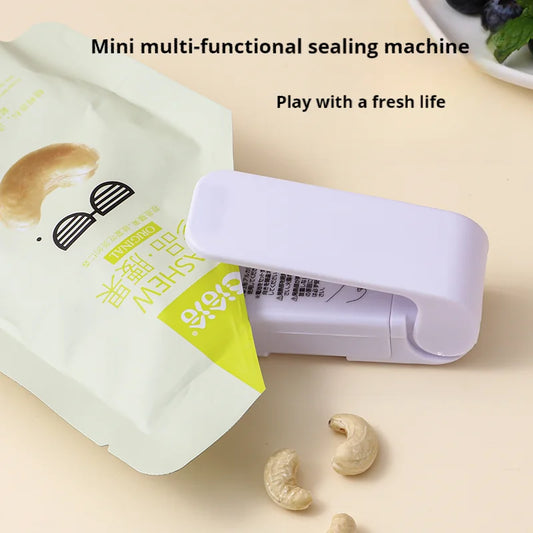 Mini sealing machine small household plastic sealing machine snack sealing artifact portable hand-pressed plastic bag sealing ma